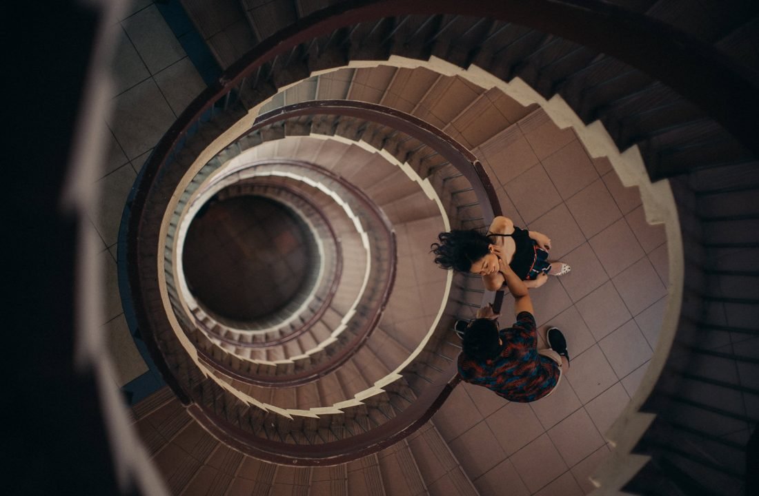 Unique couple photograph by a spiral staircase in singapore