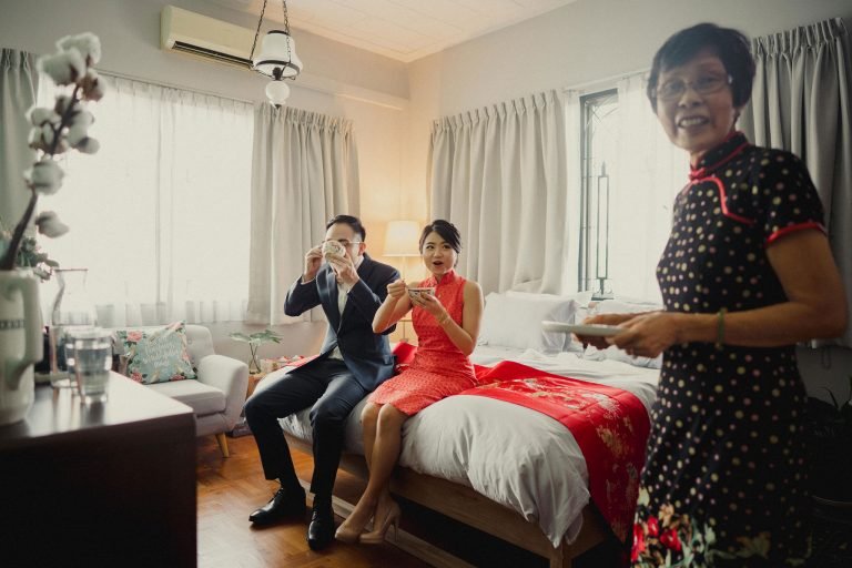 couple sharing a moment on their wedding day before heading to wesley methodist church singapore