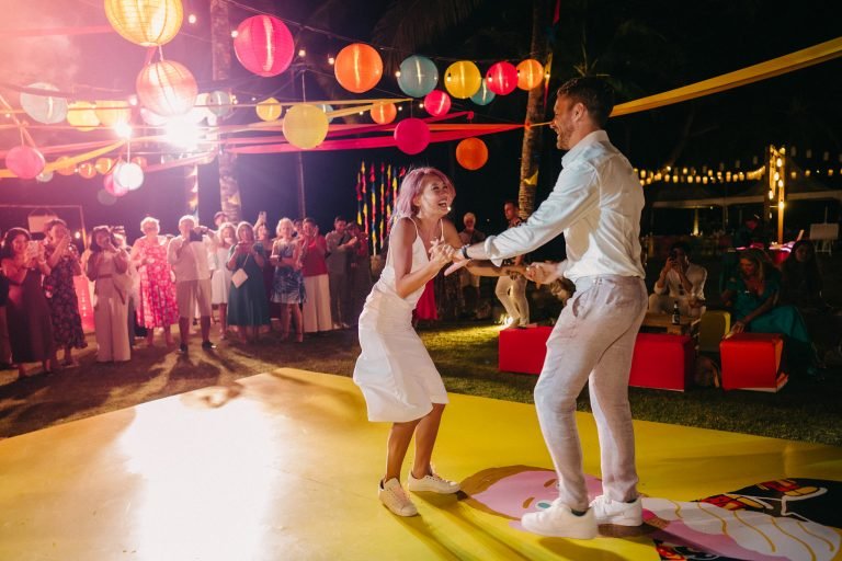 Couple dancing at an outdoor carnival wedding in Phuket Thailand