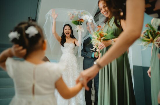 Bride and flower girl having a first look in Queenstown Lutheran Church by Singapore Wedding Photographer