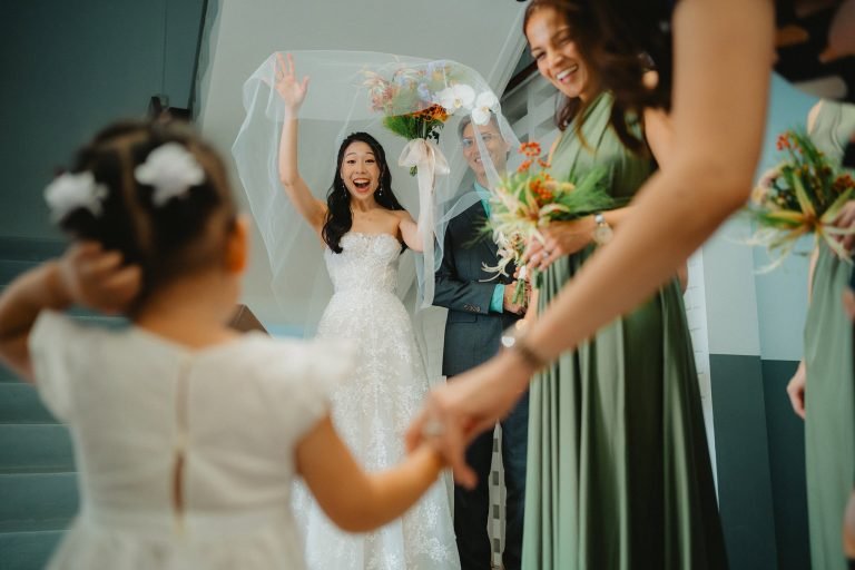 Bride and flower girl having a first look in Queenstown Lutheran Church by Singapore Wedding Photographer