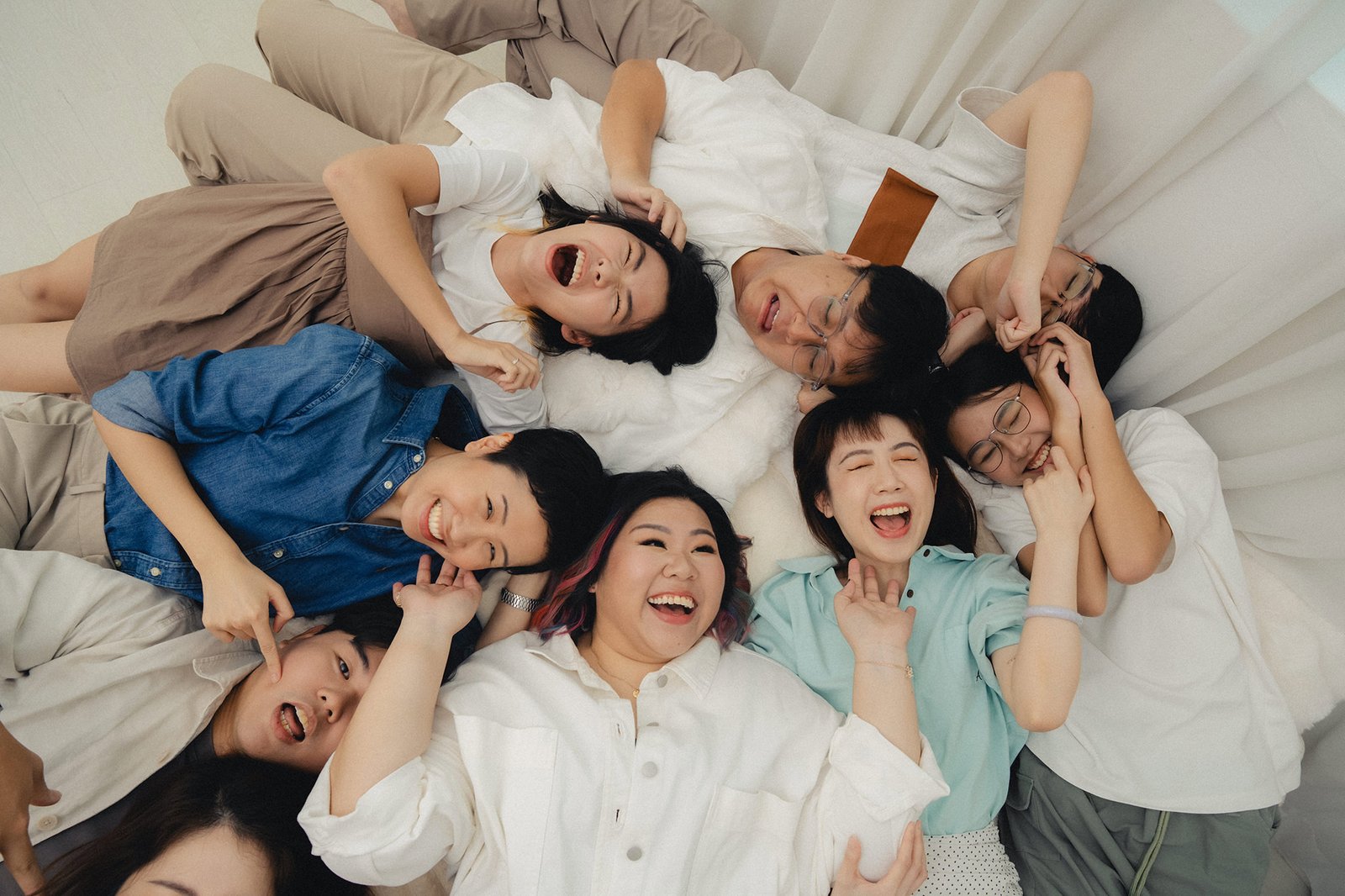 Han family enjoying a candid family photoshoot at Studio 19 Singapore filled with laughter