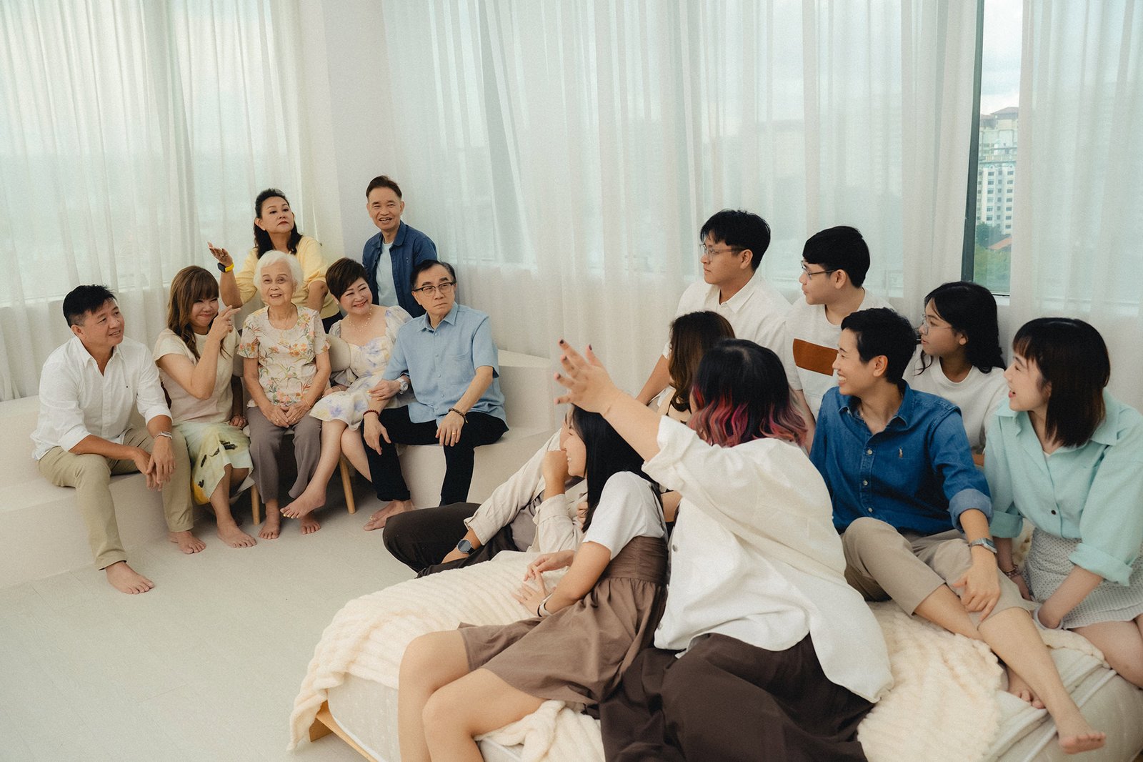 Candid interaction between family members and grandma during a Studio 19 Singapore photoshoot