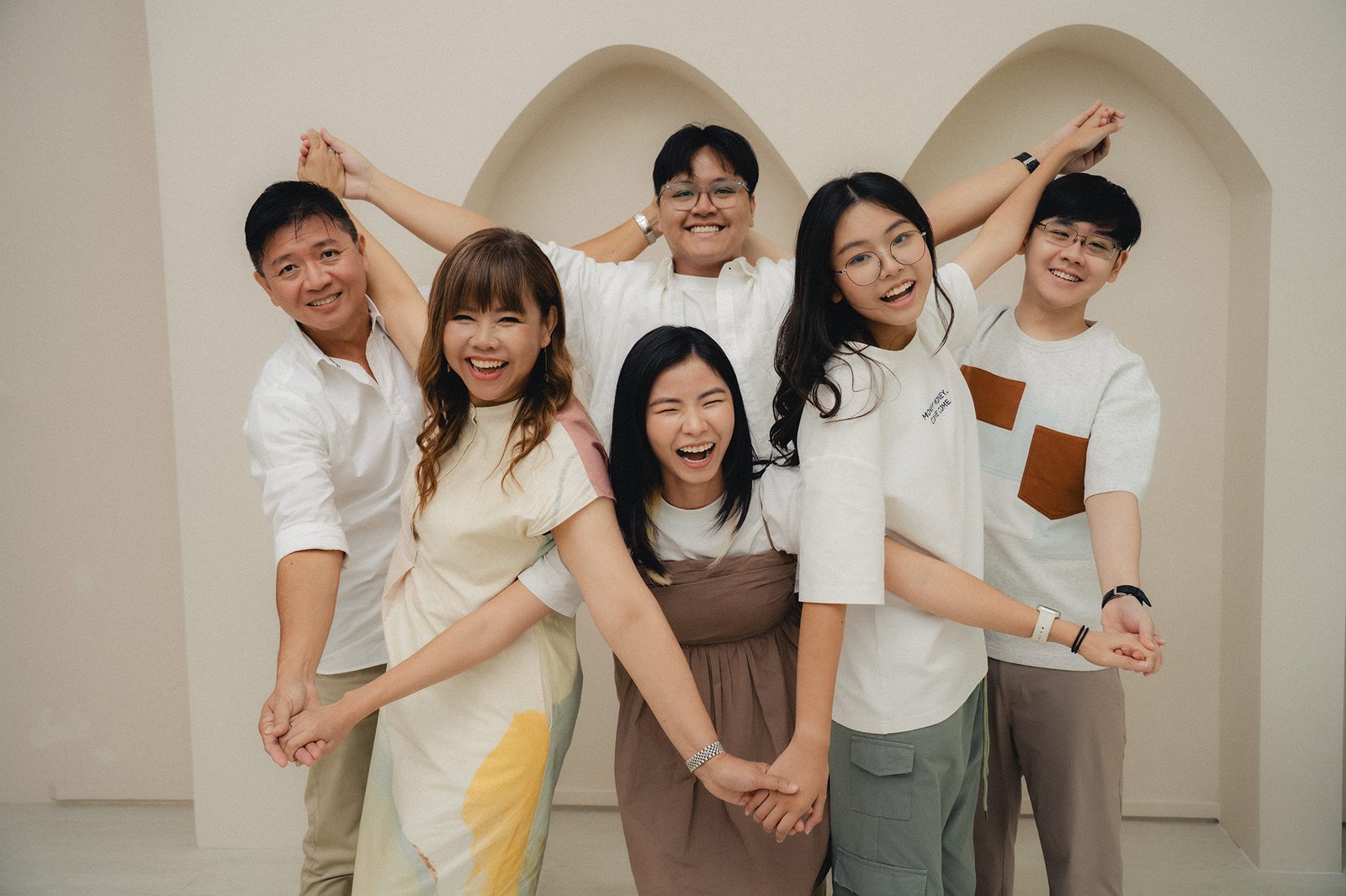 Playful family moment captured at Studio 19 Singapore during a lively photoshoot session