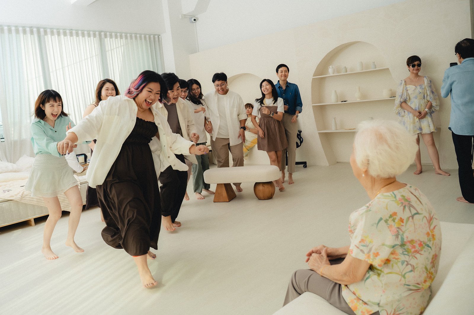 Joyful family interaction captured in a bright Studio 19 Singapore studio setting
