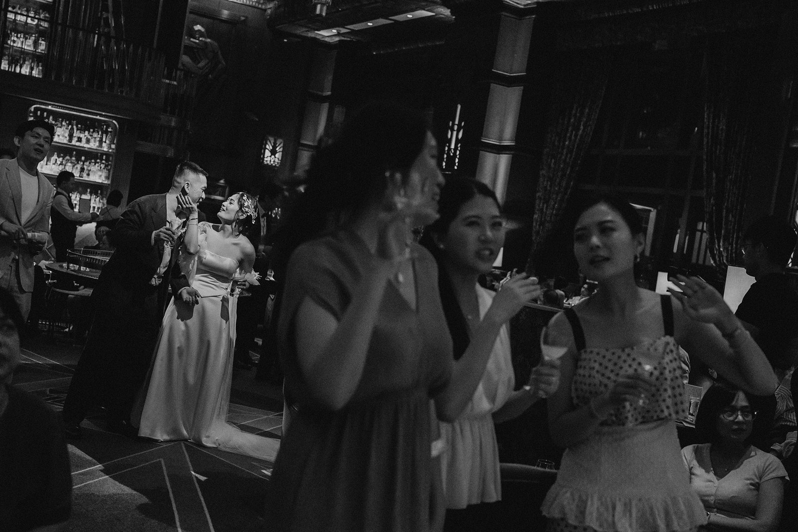 Jared and Xinyu's Atlas bar Singapore wedding reception with guests.