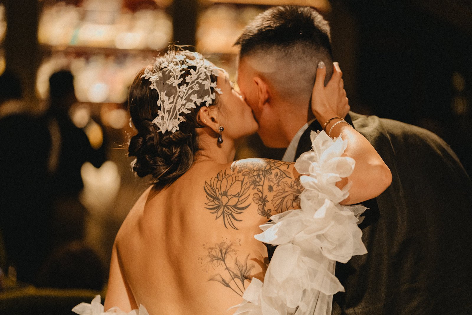 Bride and groom kiss at Atlas bar Singapore wedding