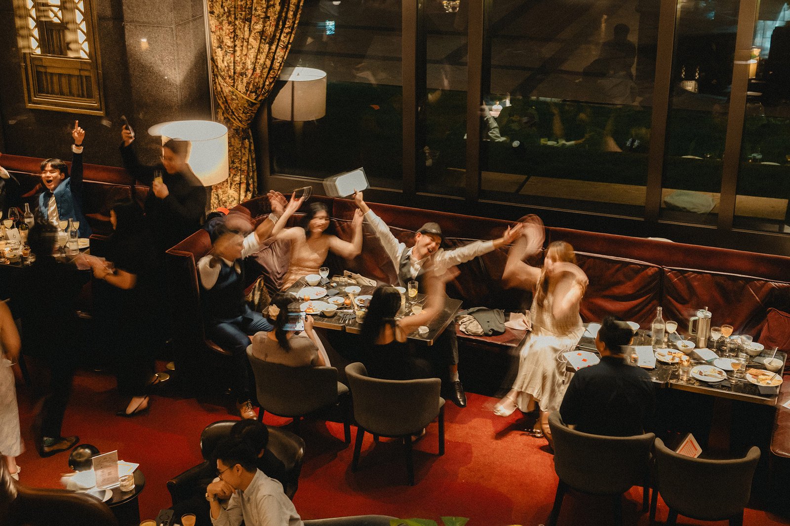 Jared and Xinyu's wedding party celebrating at Atlas Bar Singapore