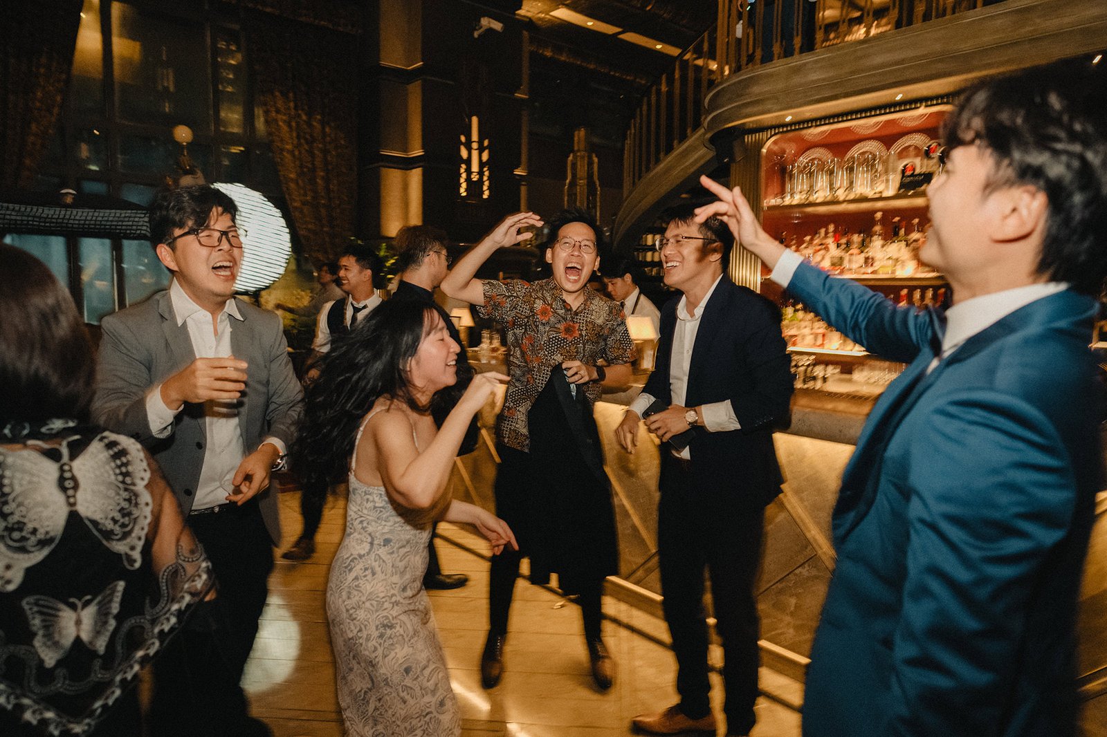 Jared + Xinyu's epic wedding at Atlas Bar Singapore, guests celebrating