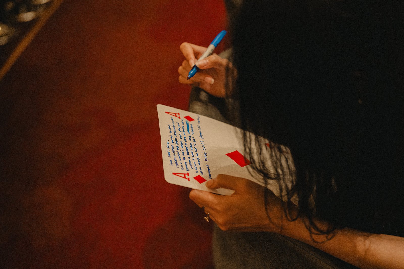 Jared and Xinyu wedding at Atlas bar Singapore, guests write on ace cards