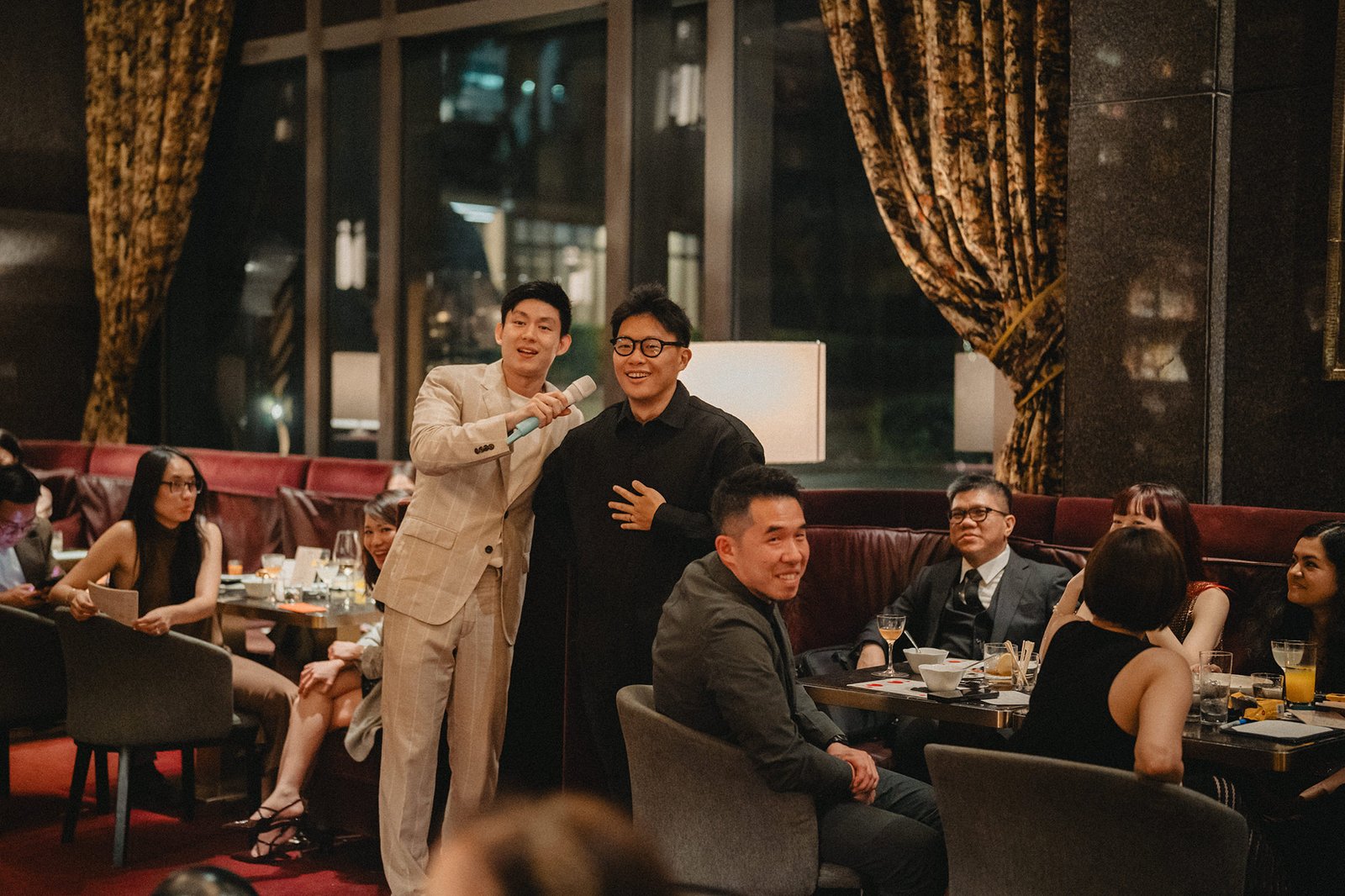 Jared and Xinyu's wedding at Atlas Bar Singapore: guests enjoy the reception.