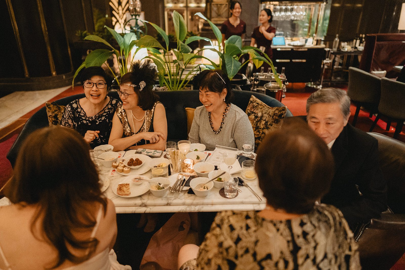 Wedding guests celebrating at Atlas Bar Singapore
