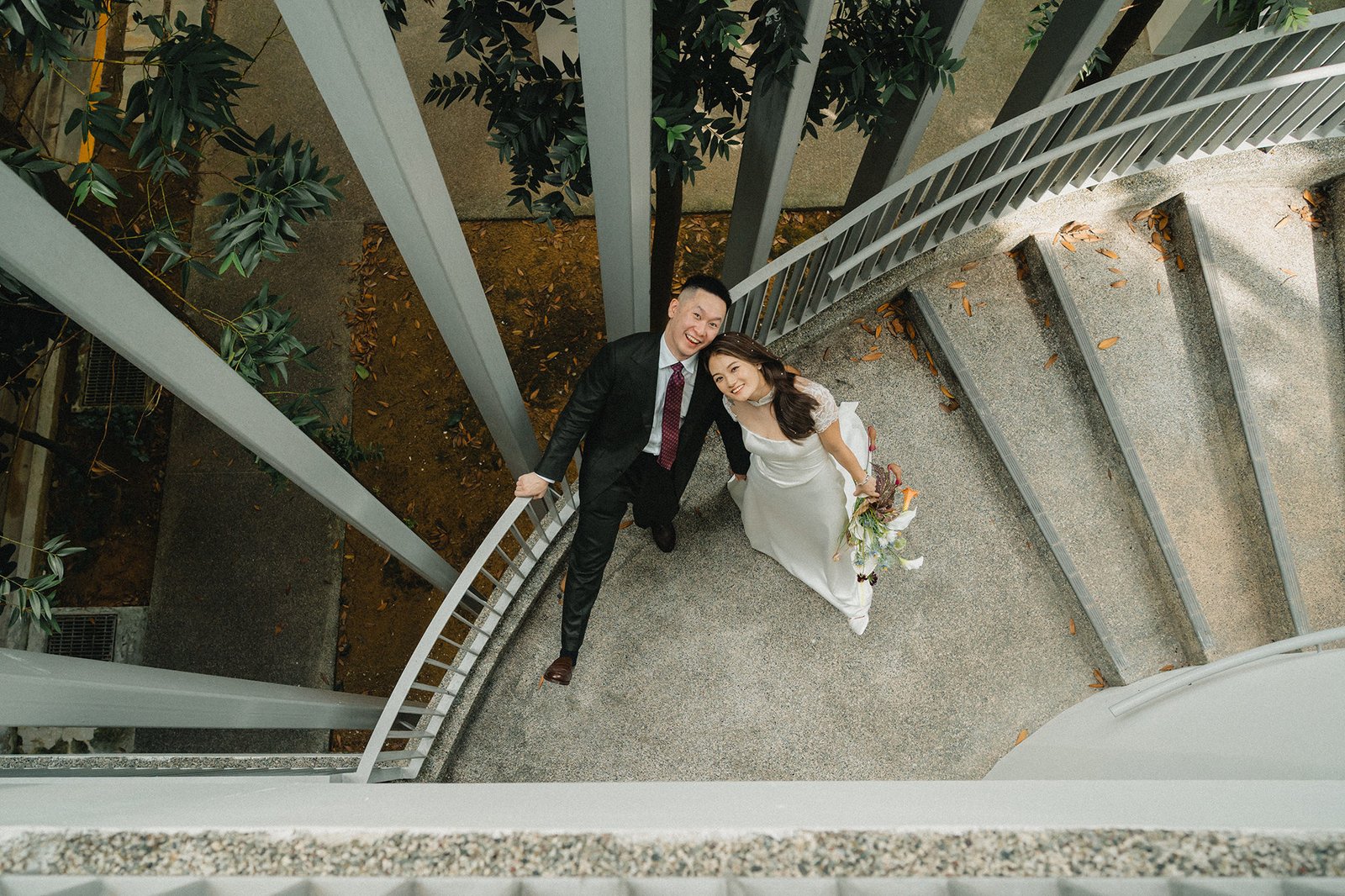 Jared and Xinyu wedding at Atlas Bar Singapore spiral staircase