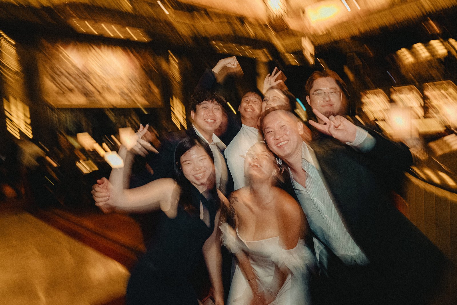 Jared and Xinyu's wedding at Atlas Bar Singapore: joyful friends celebrating