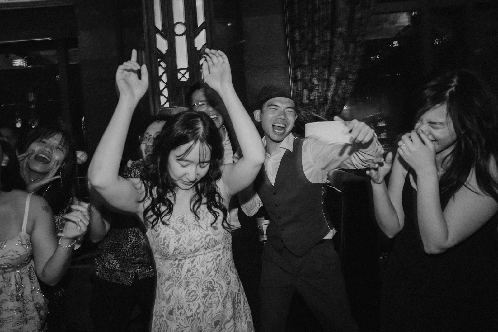 Jared and Xinyu wedding reception at Atlas Bar Singapore with guests dancing