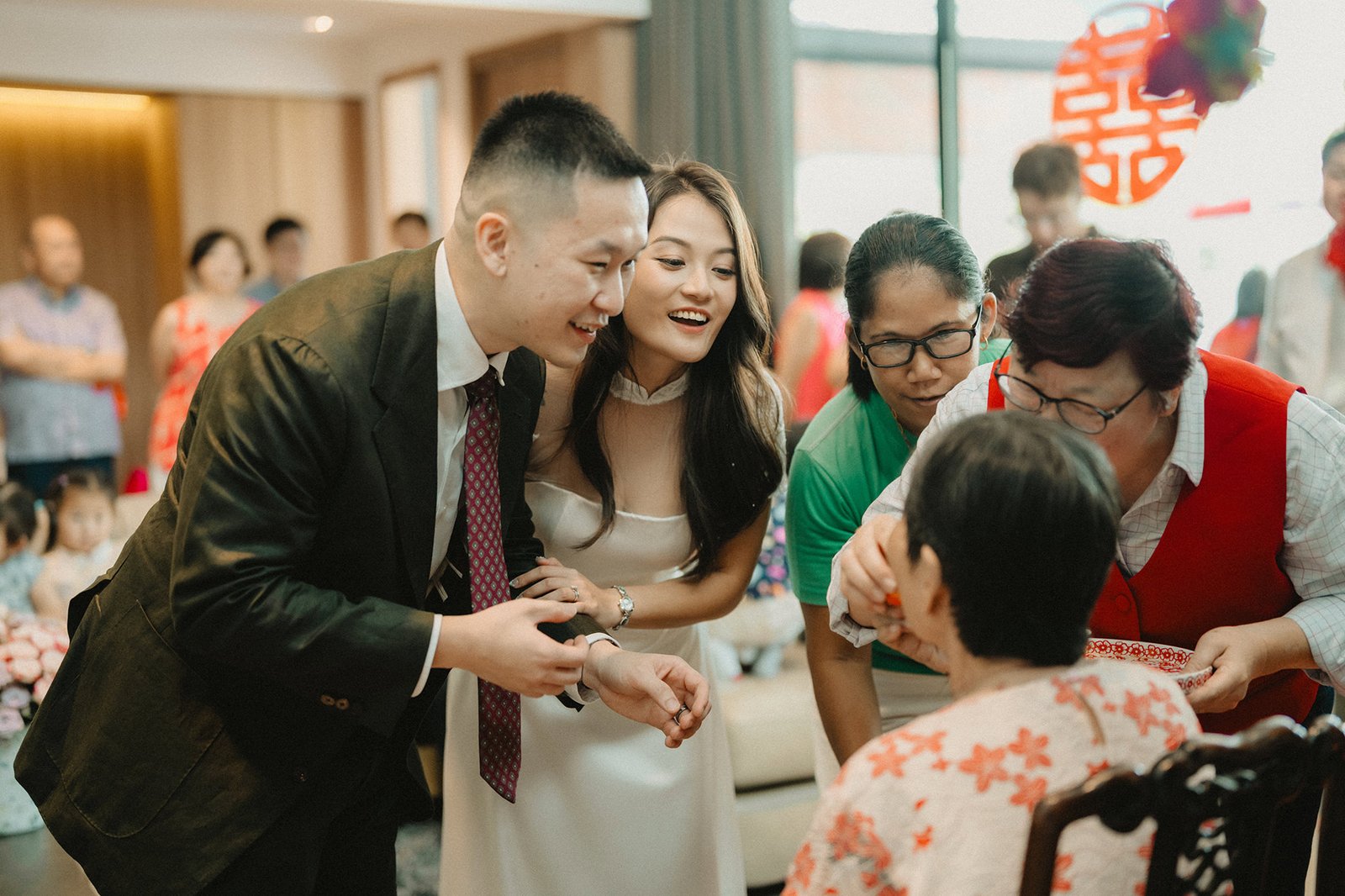 Jared and Xinyu's wedding at Atlas Bar Singapore, a joyful moment with family.