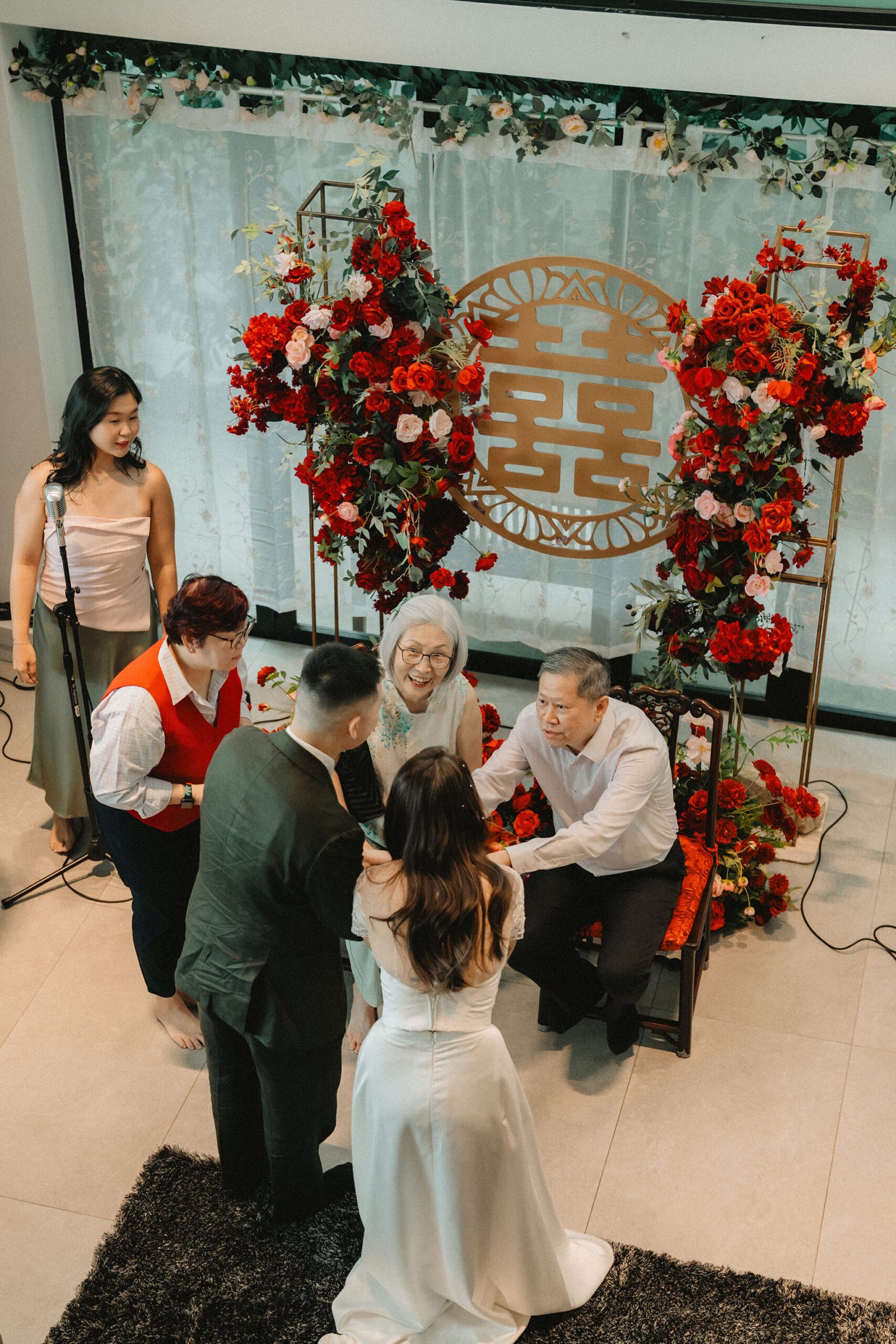 Wedding ceremony at Atlas bar Singapore with bride, groom, and family.