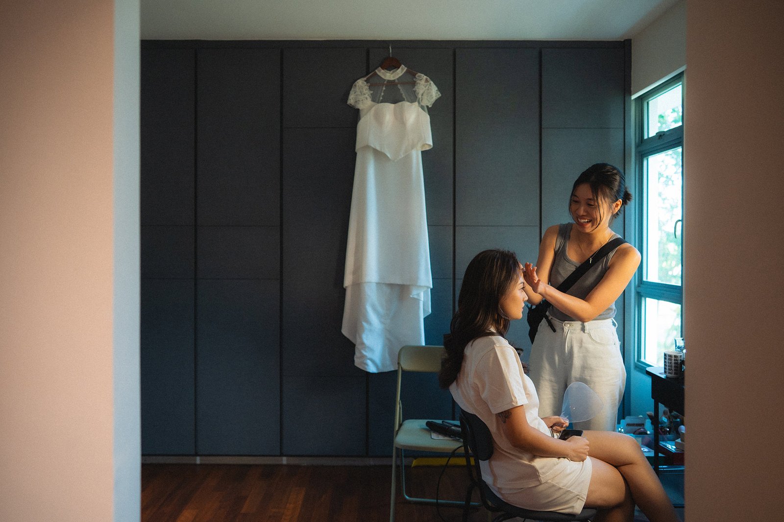 Bride getting ready for Atlas Bar Singapore wedding with makeup artist