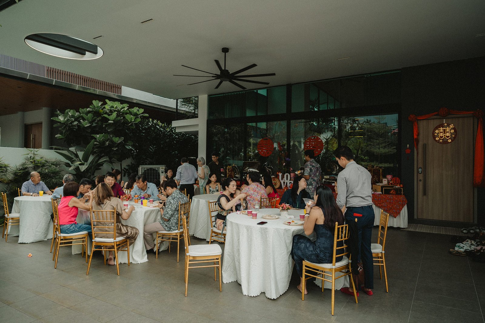 Jared + Xinyu wedding reception at Atlas bar Singapore with guests dining