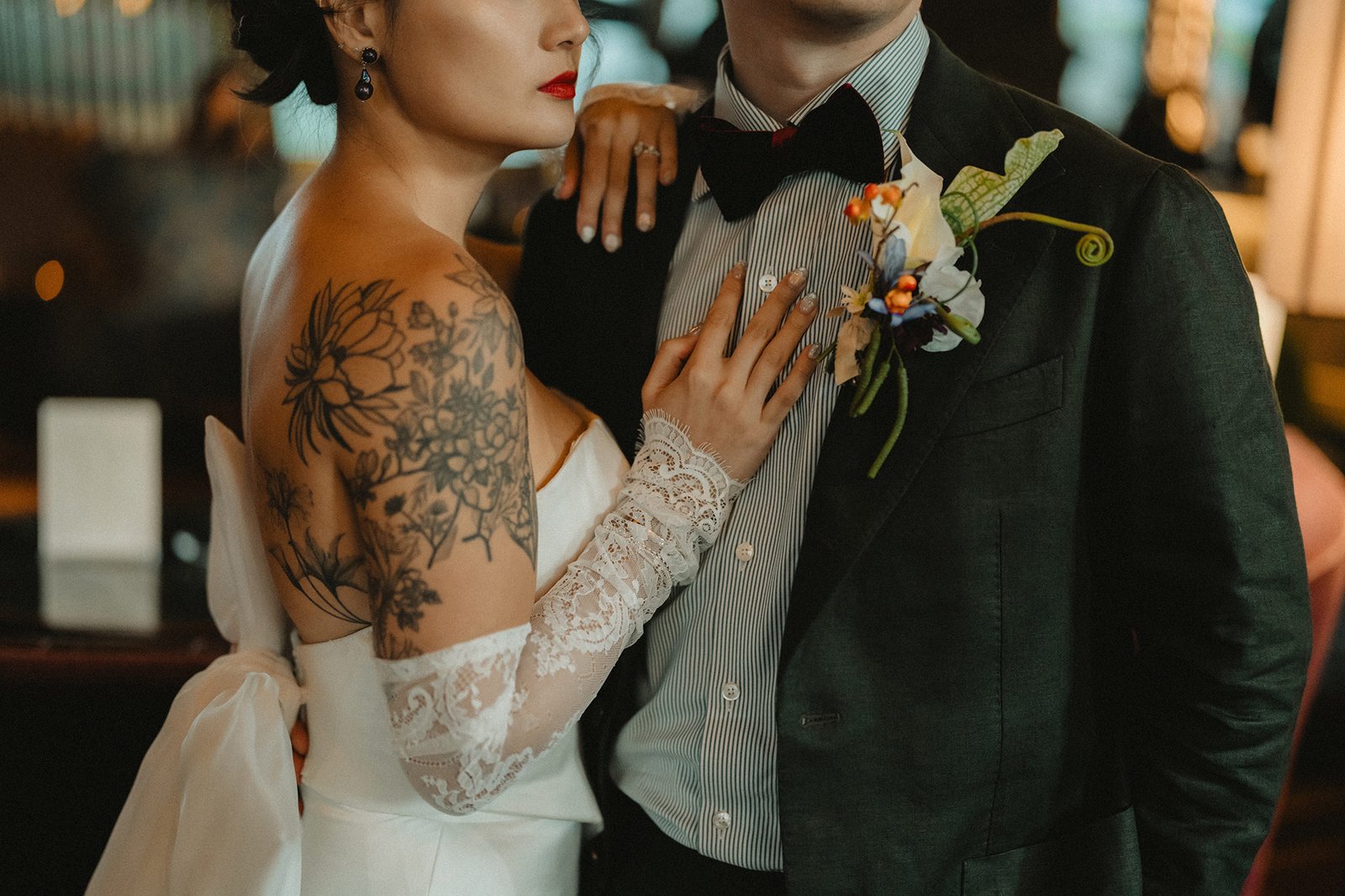 Bride and groom embrace at Atlas Bar Singapore wedding