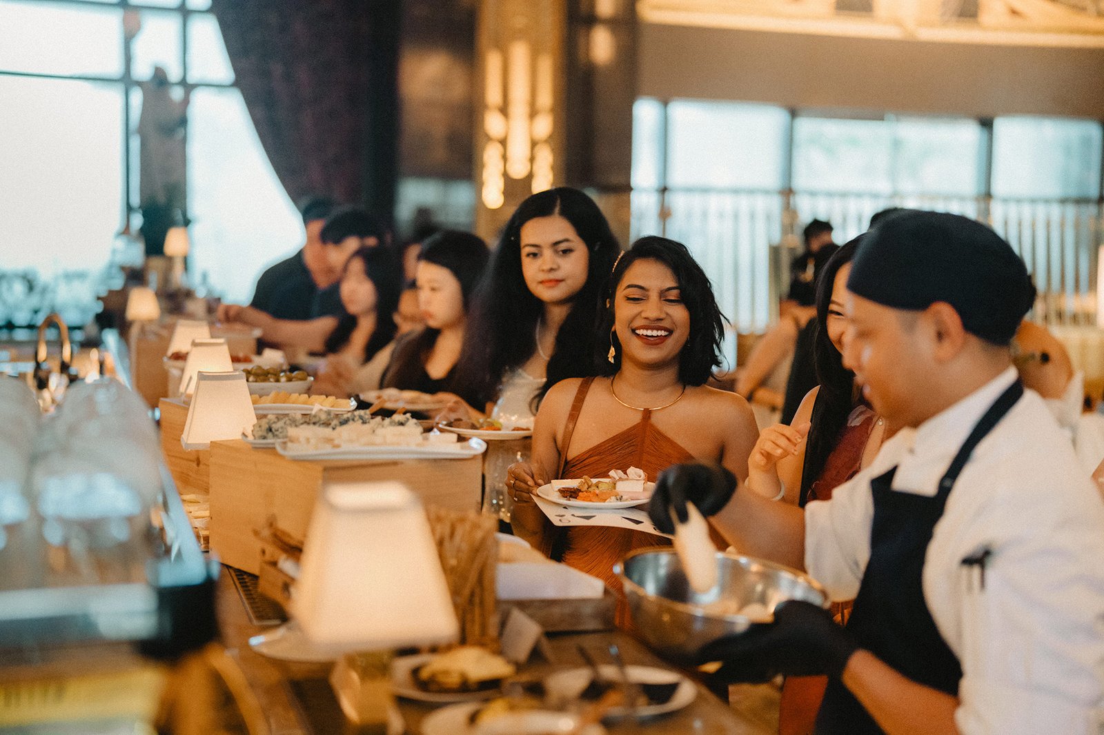 Jared and Xinyu wedding guests enjoying food at Atlas Bar Singapore