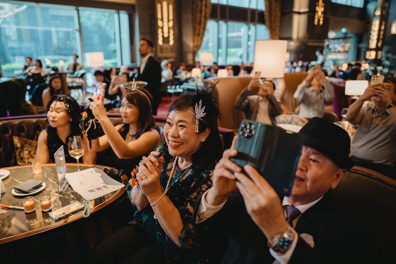 Guests at Atlas Bar Singapore wedding capture moments with phones