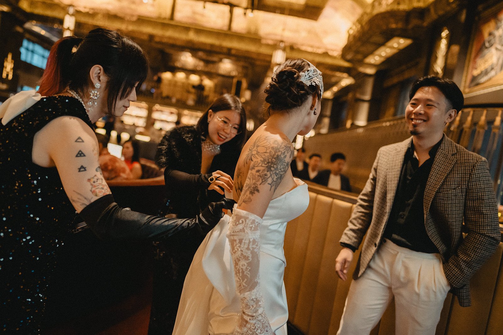 Bride getting ready at Atlas Bar Singapore wedding, groom watches