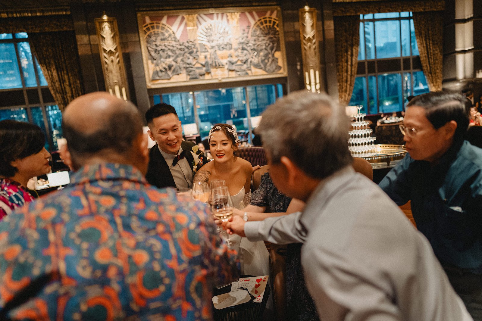 Jared and Xinyu celebrate their Atlas Bar Singapore wedding with guests.