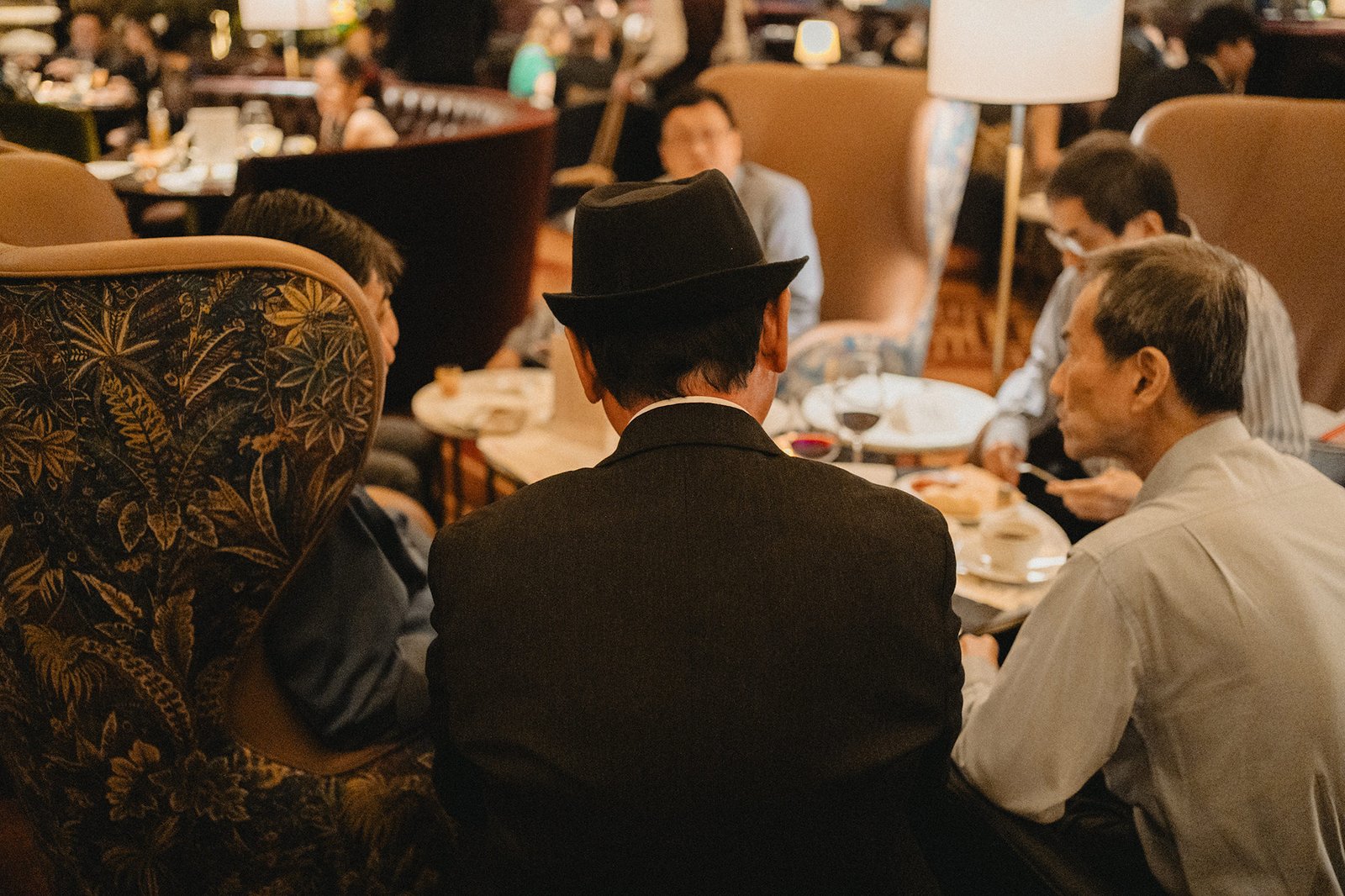 Groomsmen in suits and hats at Atlas Bar Singapore wedding