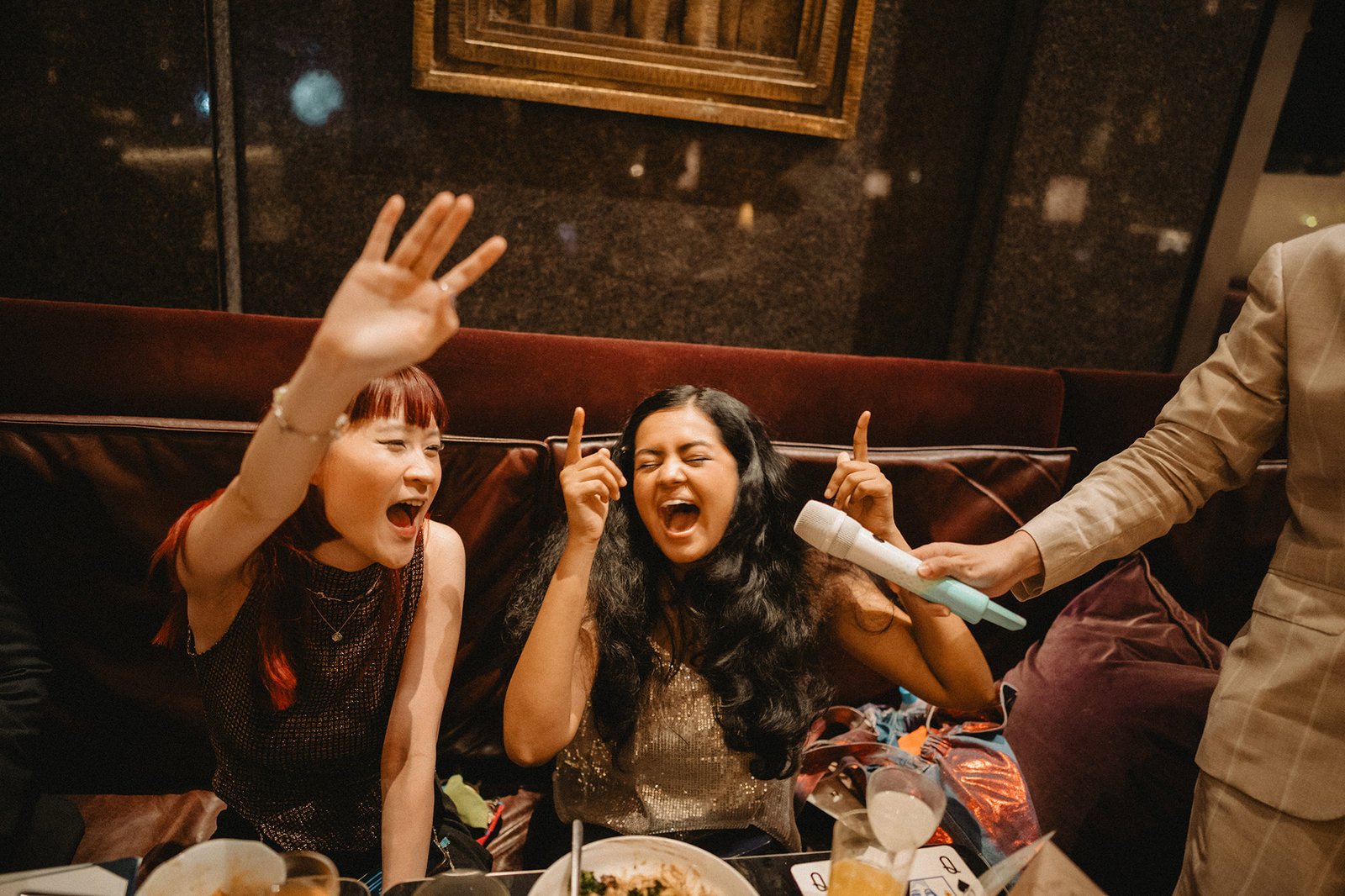 Jared and Xinyu's wedding guests celebrating at Atlas Bar Singapore
