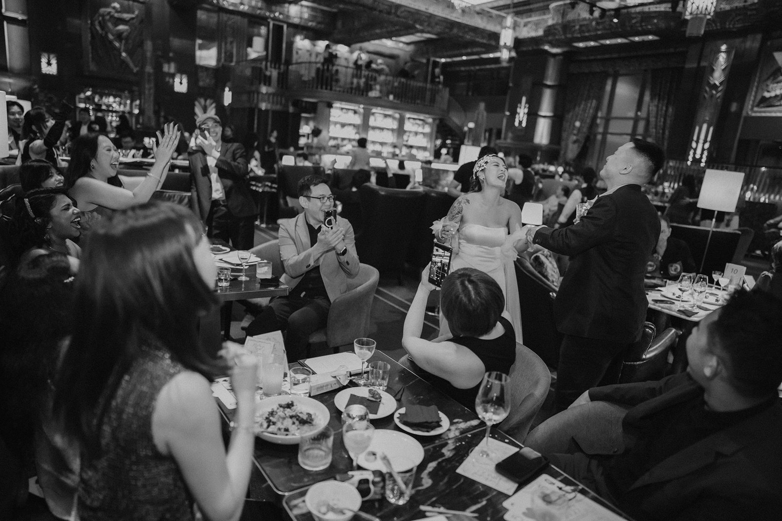 Jared + Xinyu's epic wedding at Atlas Bar Singapore: guests celebrating