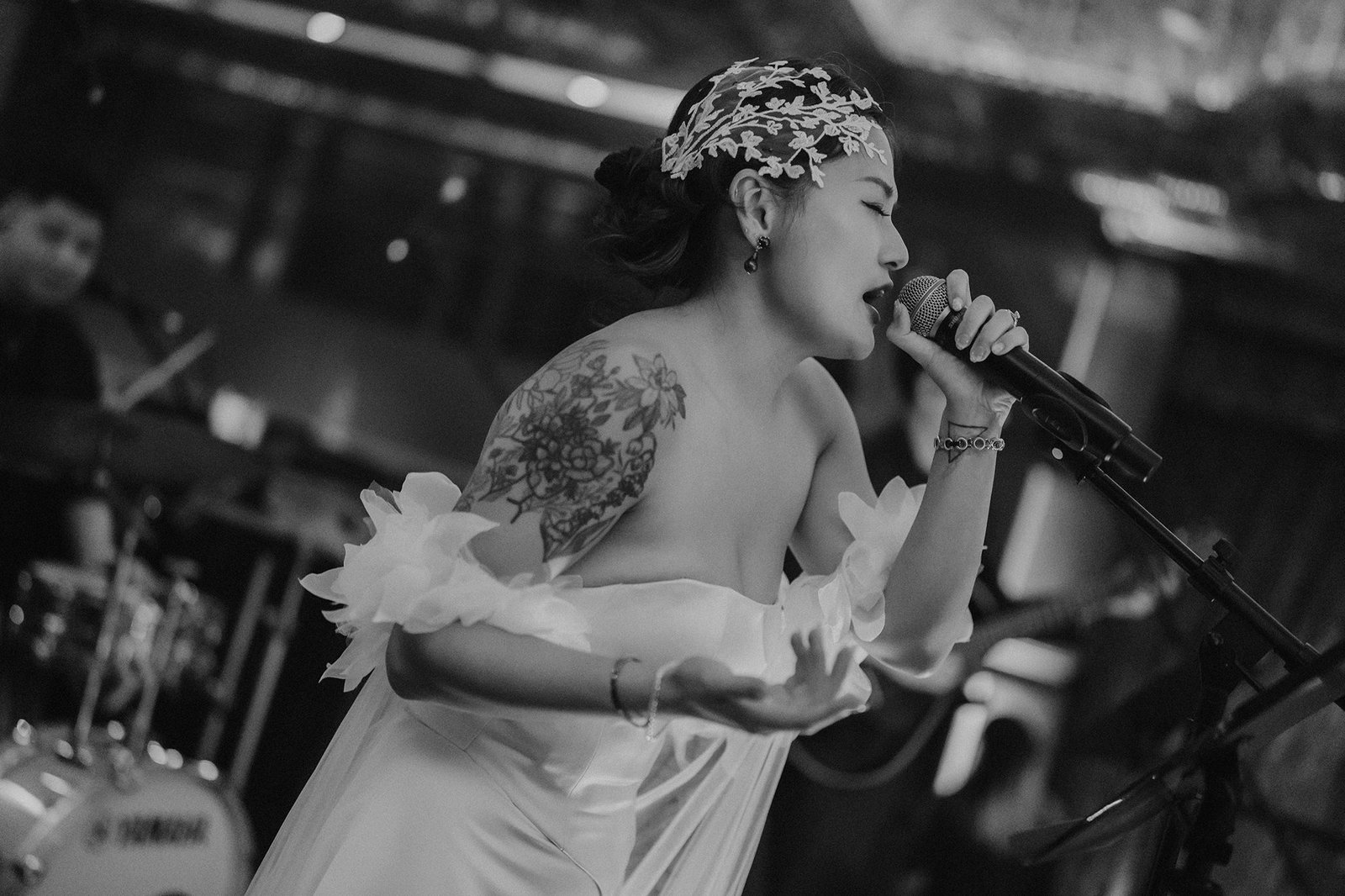 Singer performing at an Atlas Bar Singapore wedding celebration