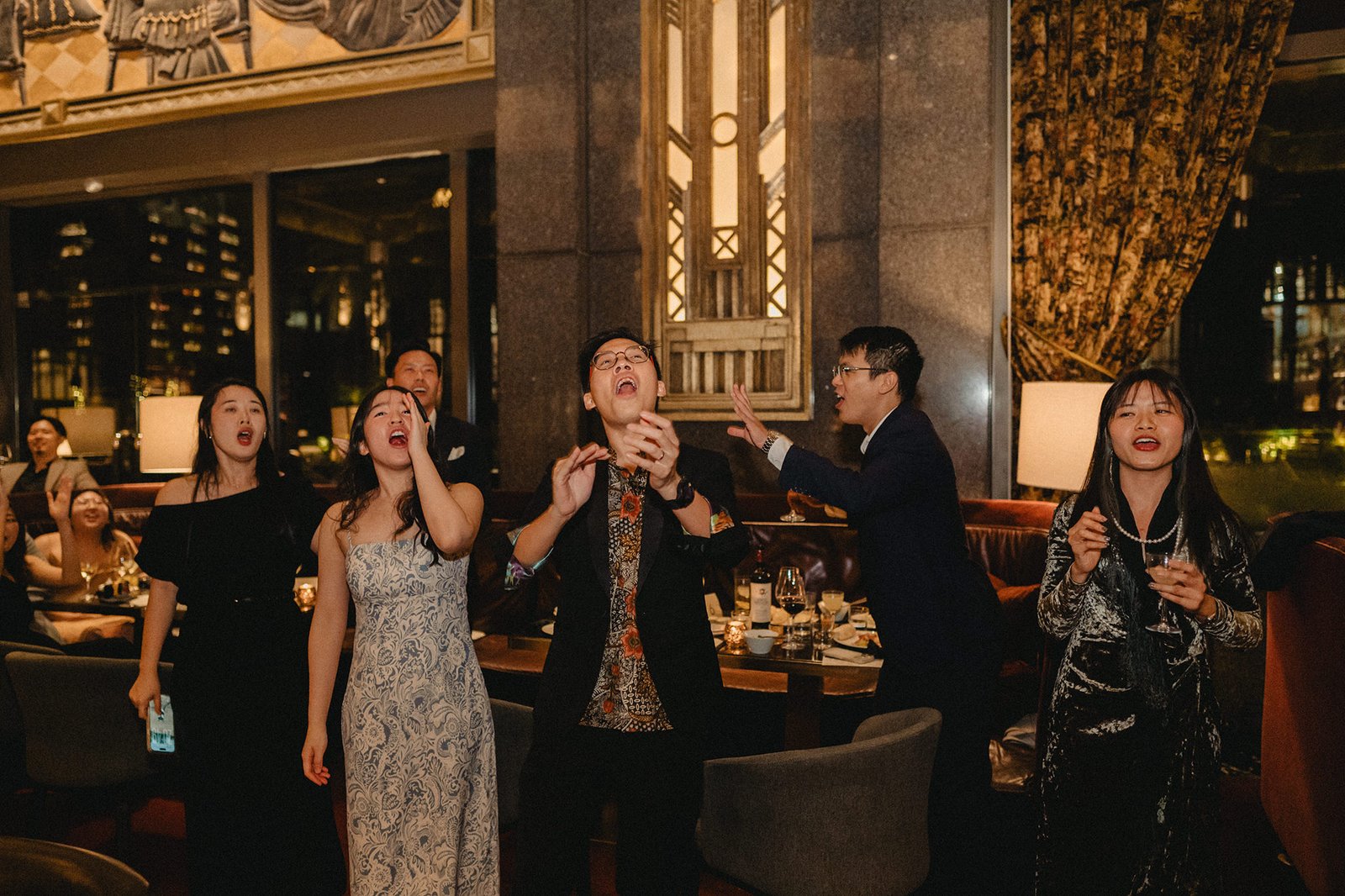 Wedding guests celebrating at Atlas Bar Singapore