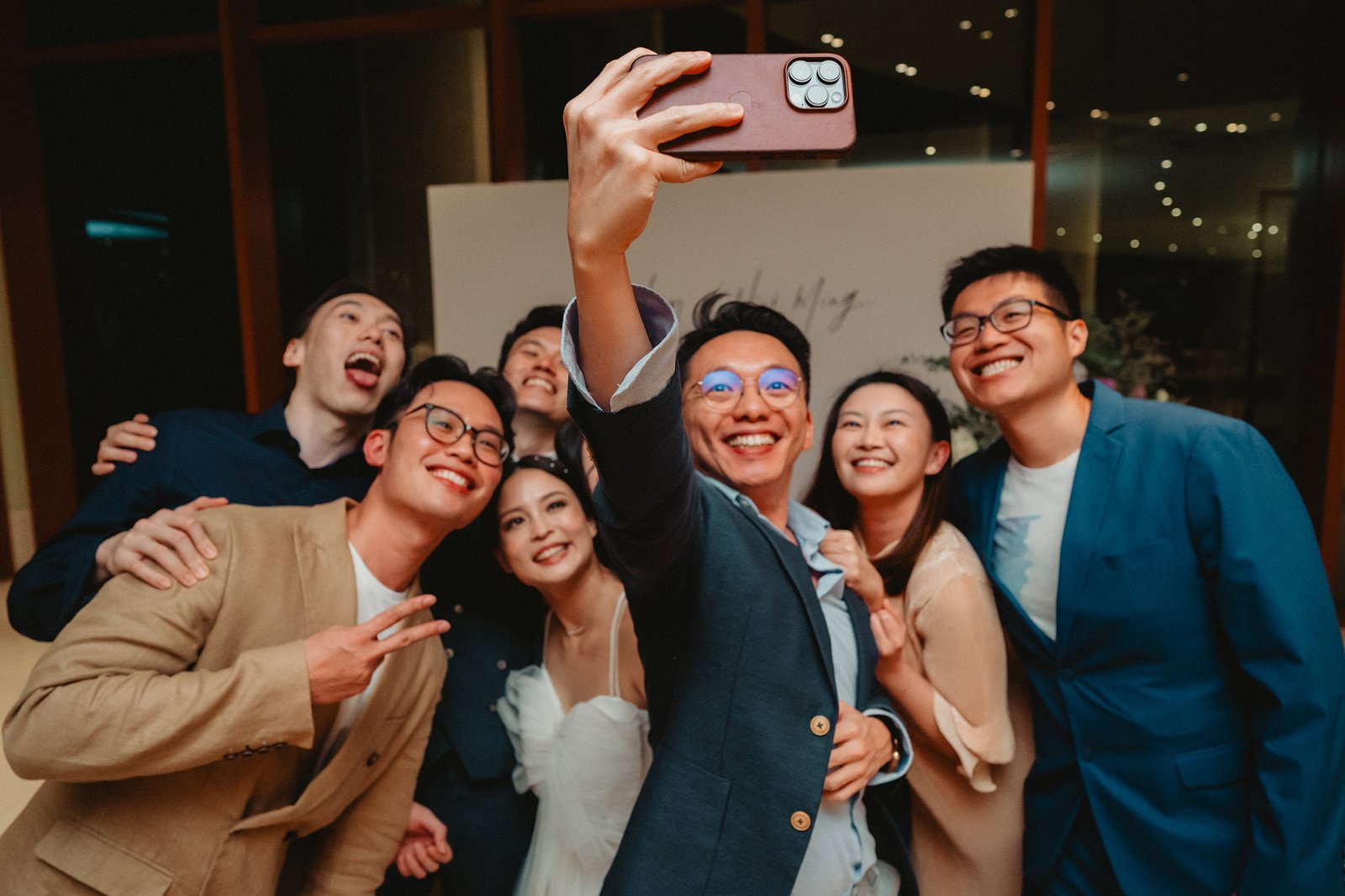 Wedding party at Capella Singapore: Han and Ming with friends taking a selfie.
