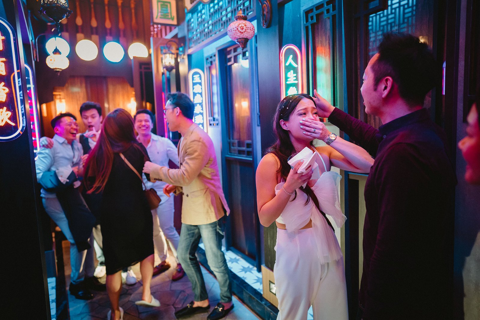 Capella Singapore wedding: Couple celebrates with friends in vibrant alleyway