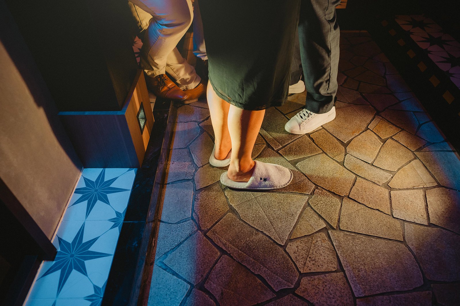 Capella Singapore wedding: Guests in slippers and shoes on tiled floor