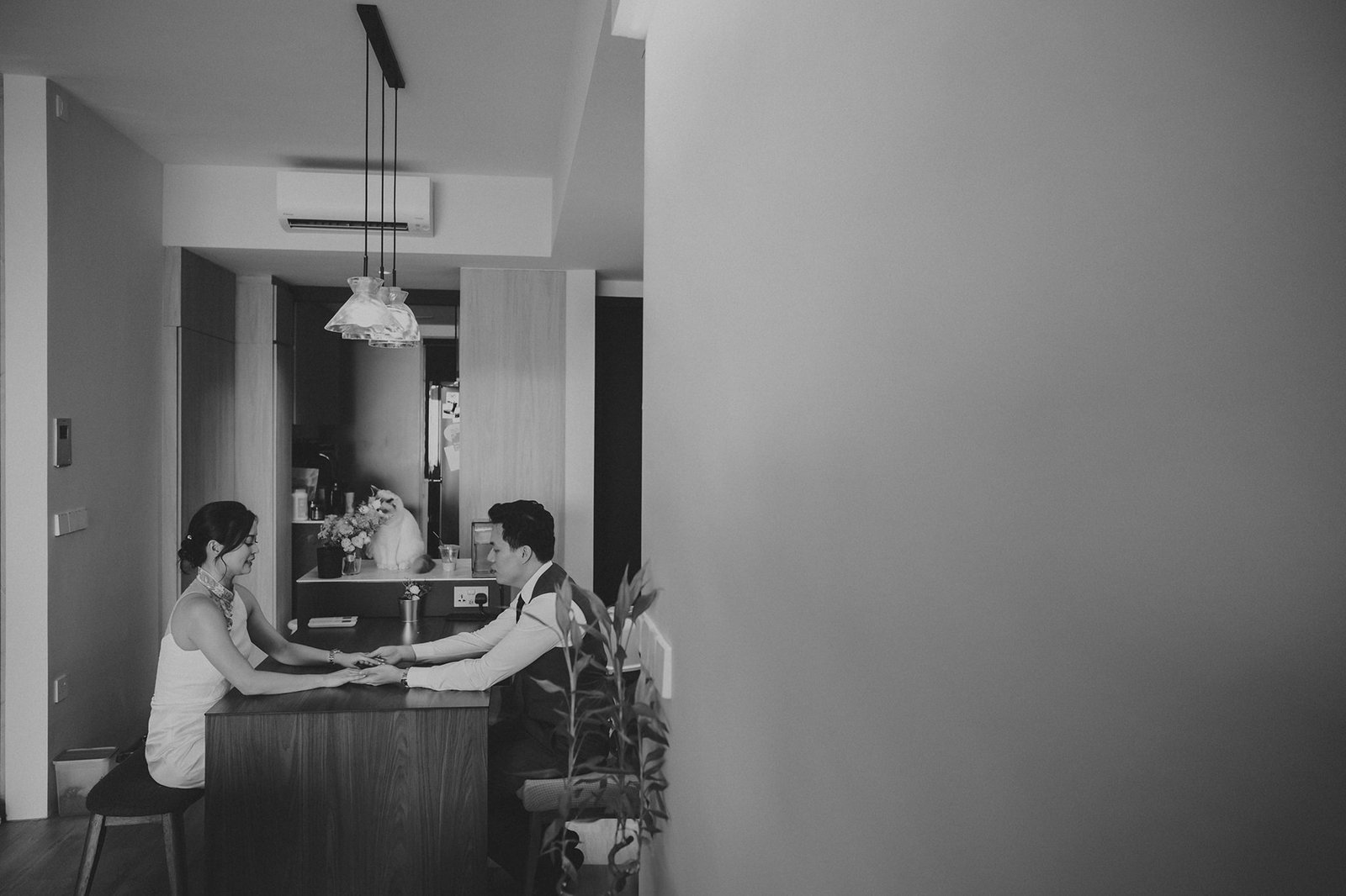Couple holding hands at Capella Singapore wedding