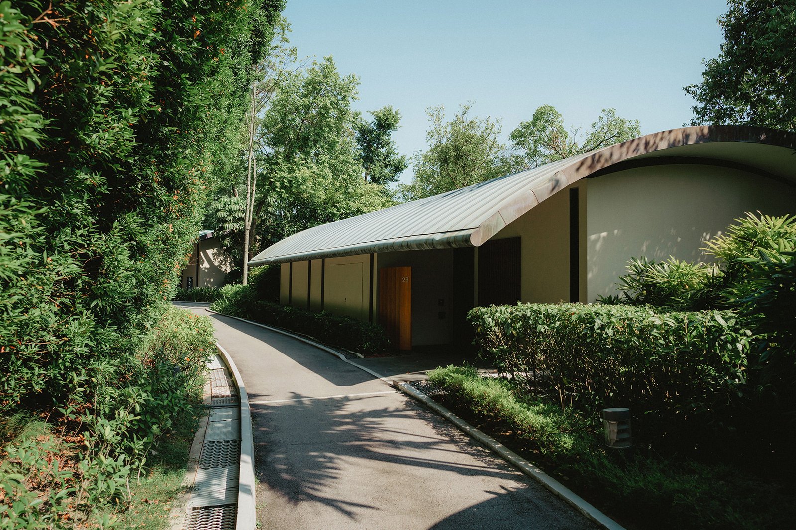 Capella Singapore wedding venue pathway with lush greenery and modern architecture