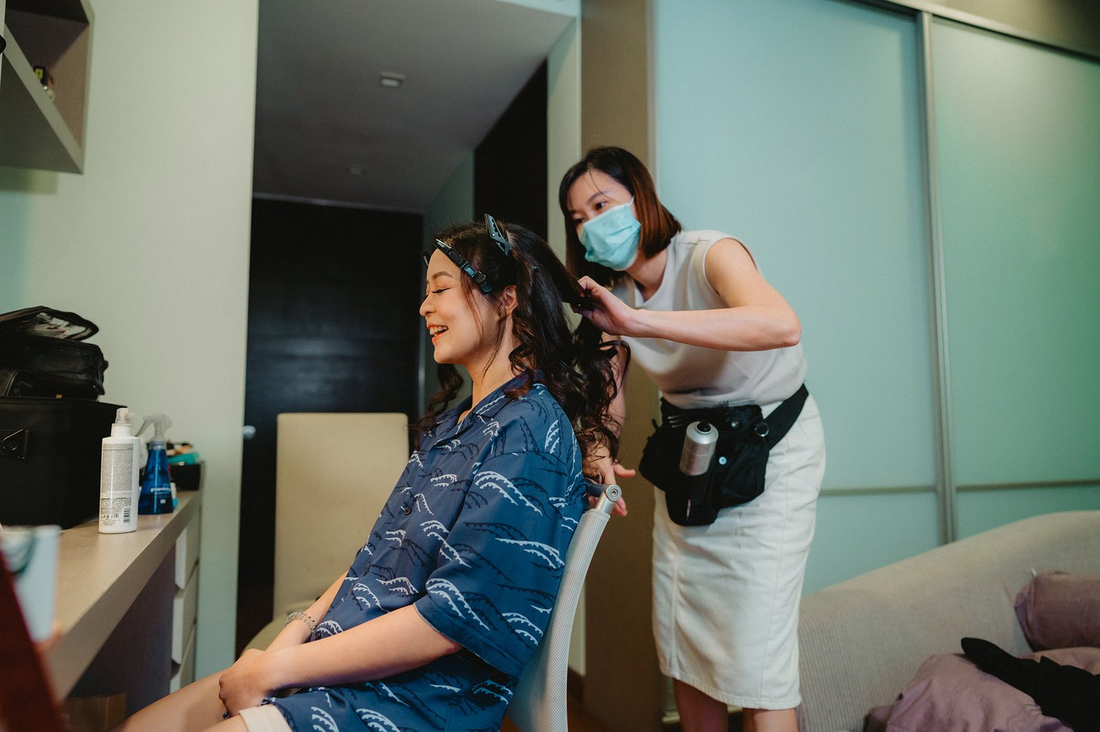 Bride getting hair styled at Capella Singapore wedding