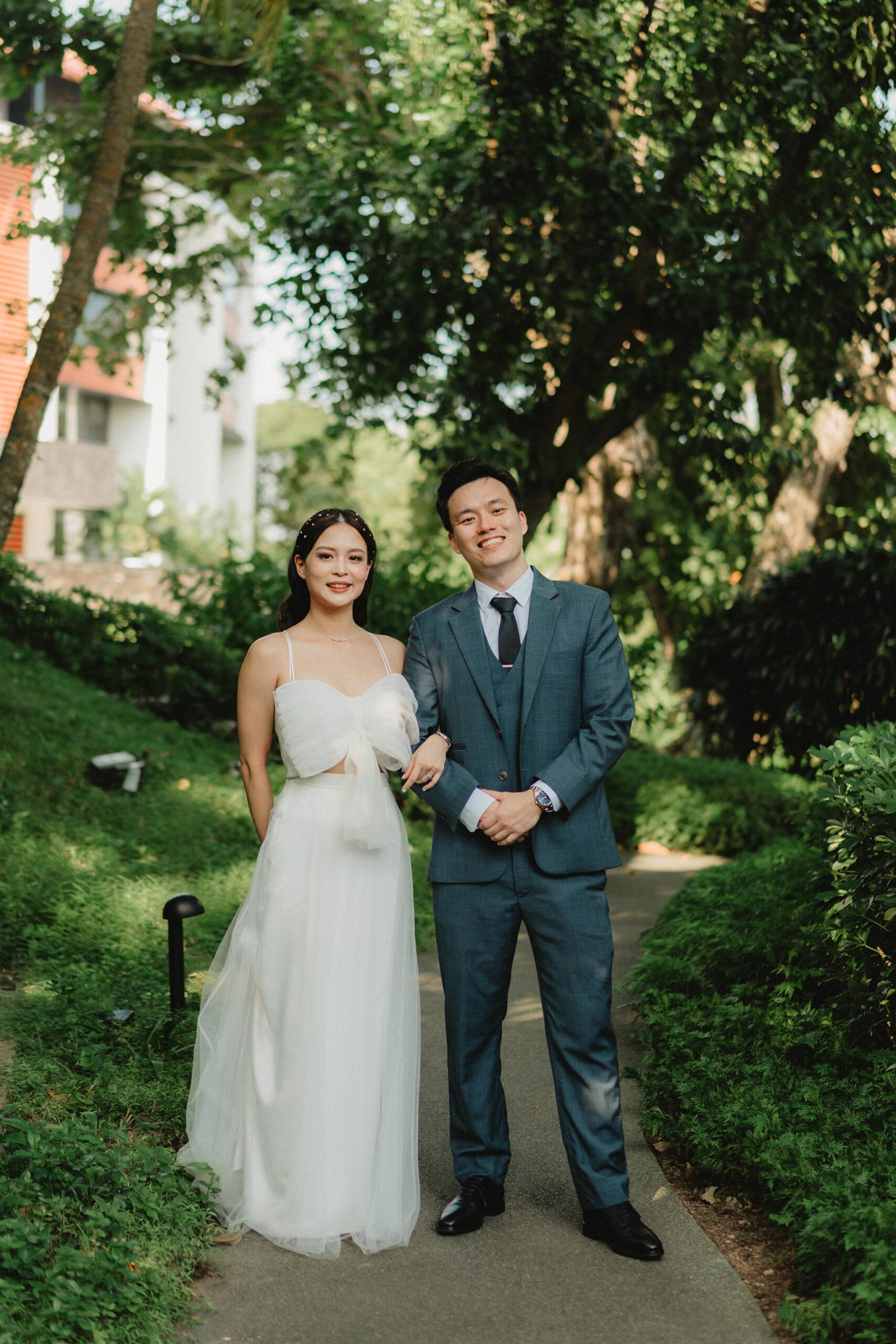 Han and Ming in wedding attire at a Capella Singapore wedding.