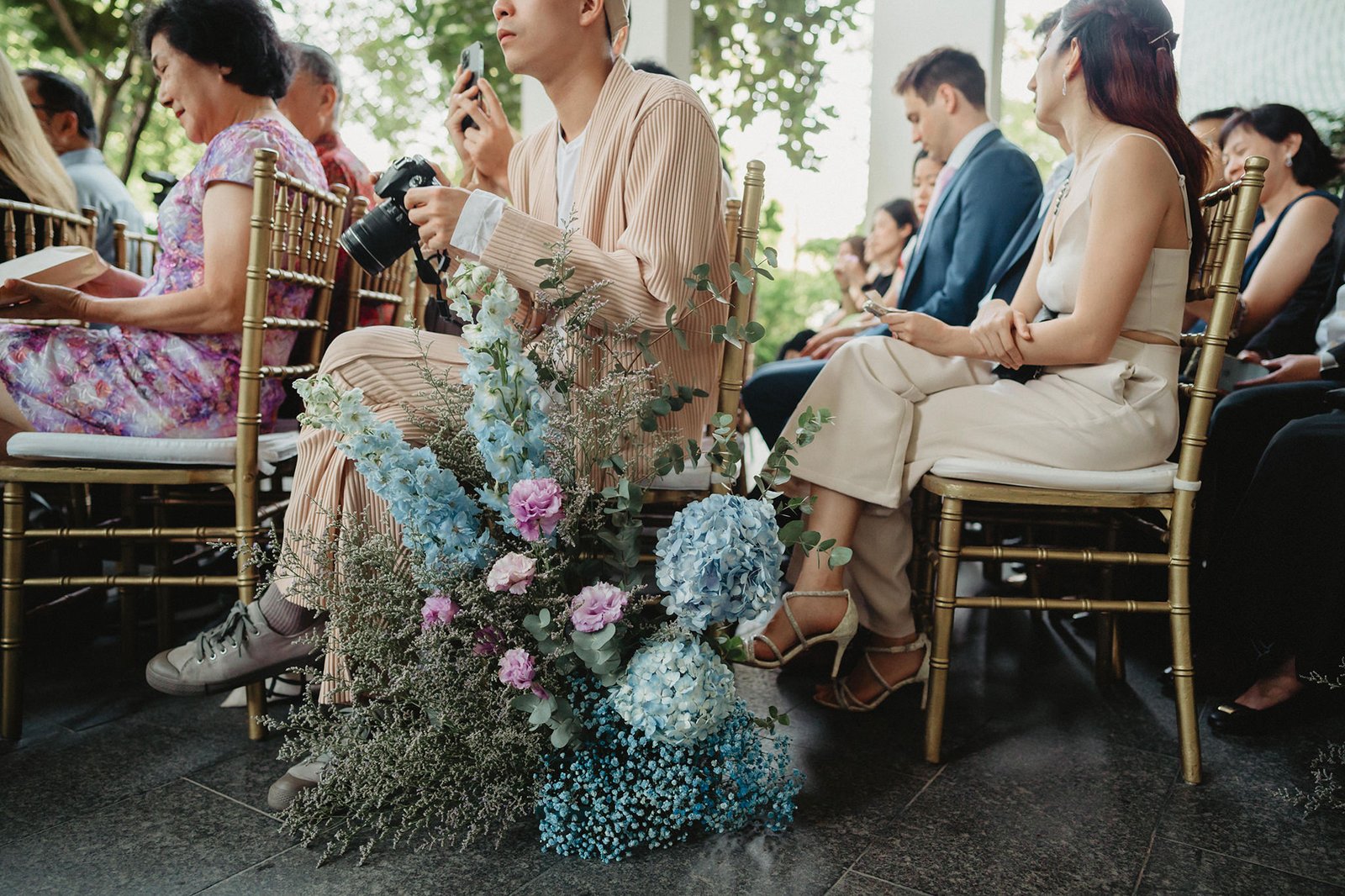 Capella Singapore wedding guests seated with floral arrangement