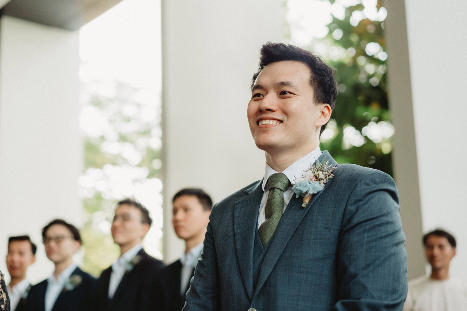 Groom smiling at Capella Singapore wedding ceremony