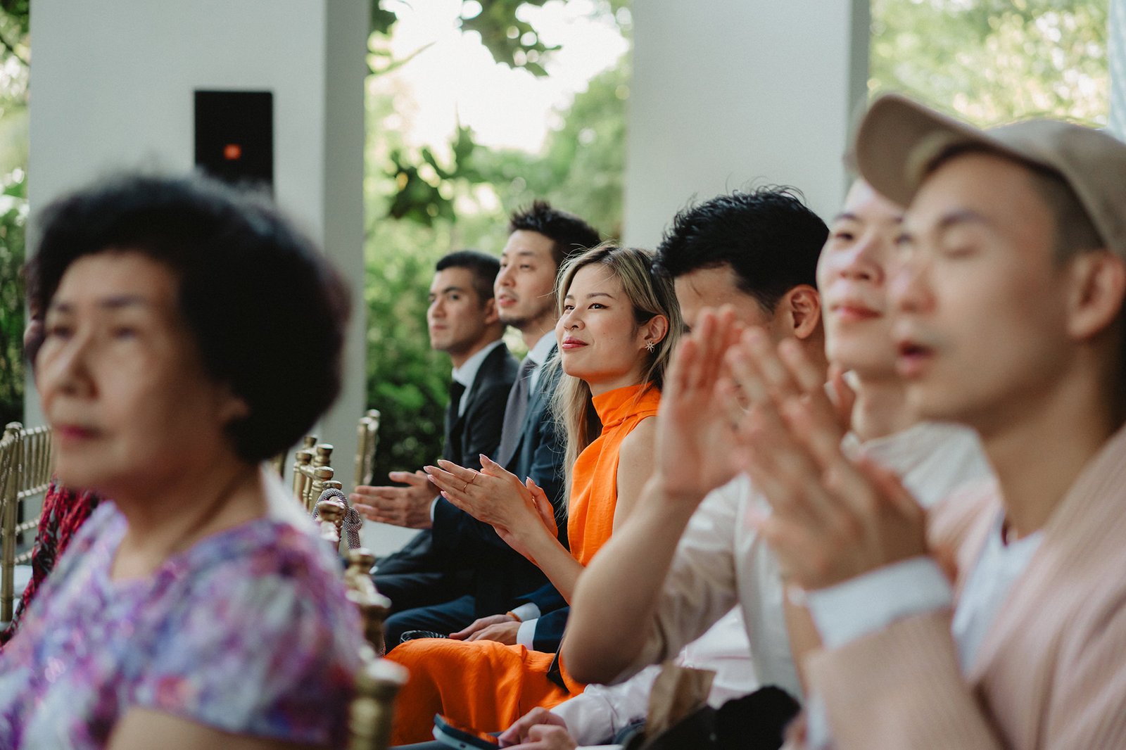 Guests applaud at a Capella Singapore wedding ceremony, Han + Ming // Chasing Dragons