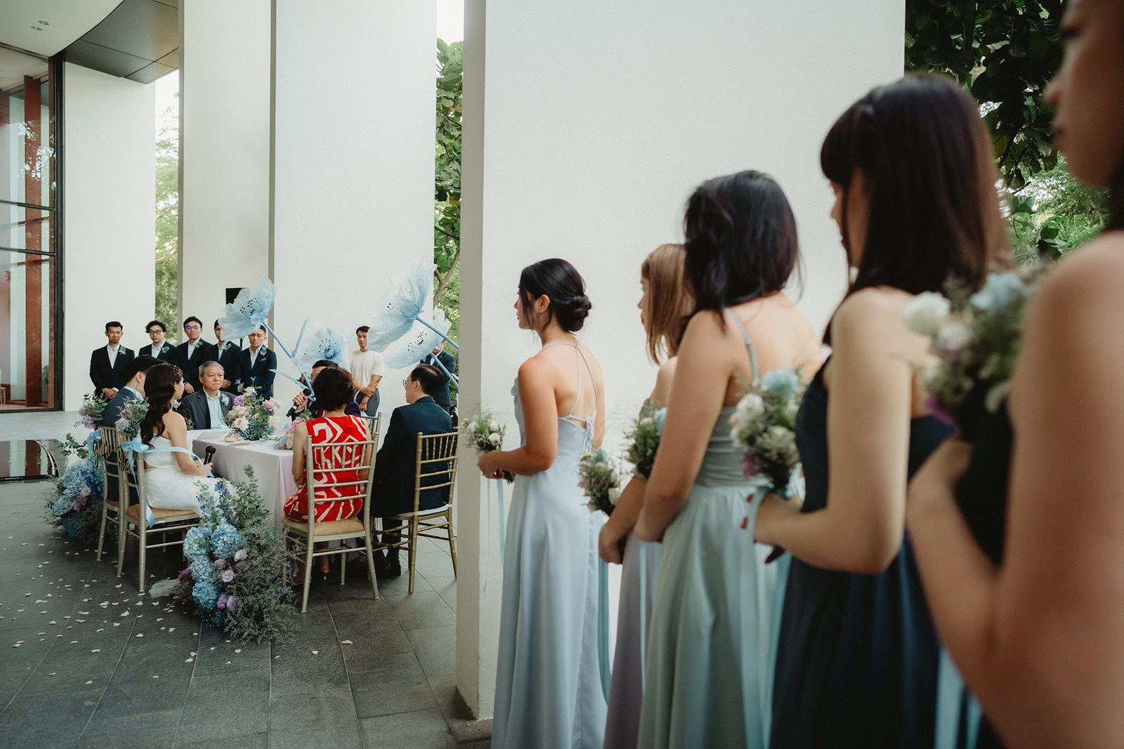 Bridal party at a Capella Singapore wedding ceremony, guests seated.