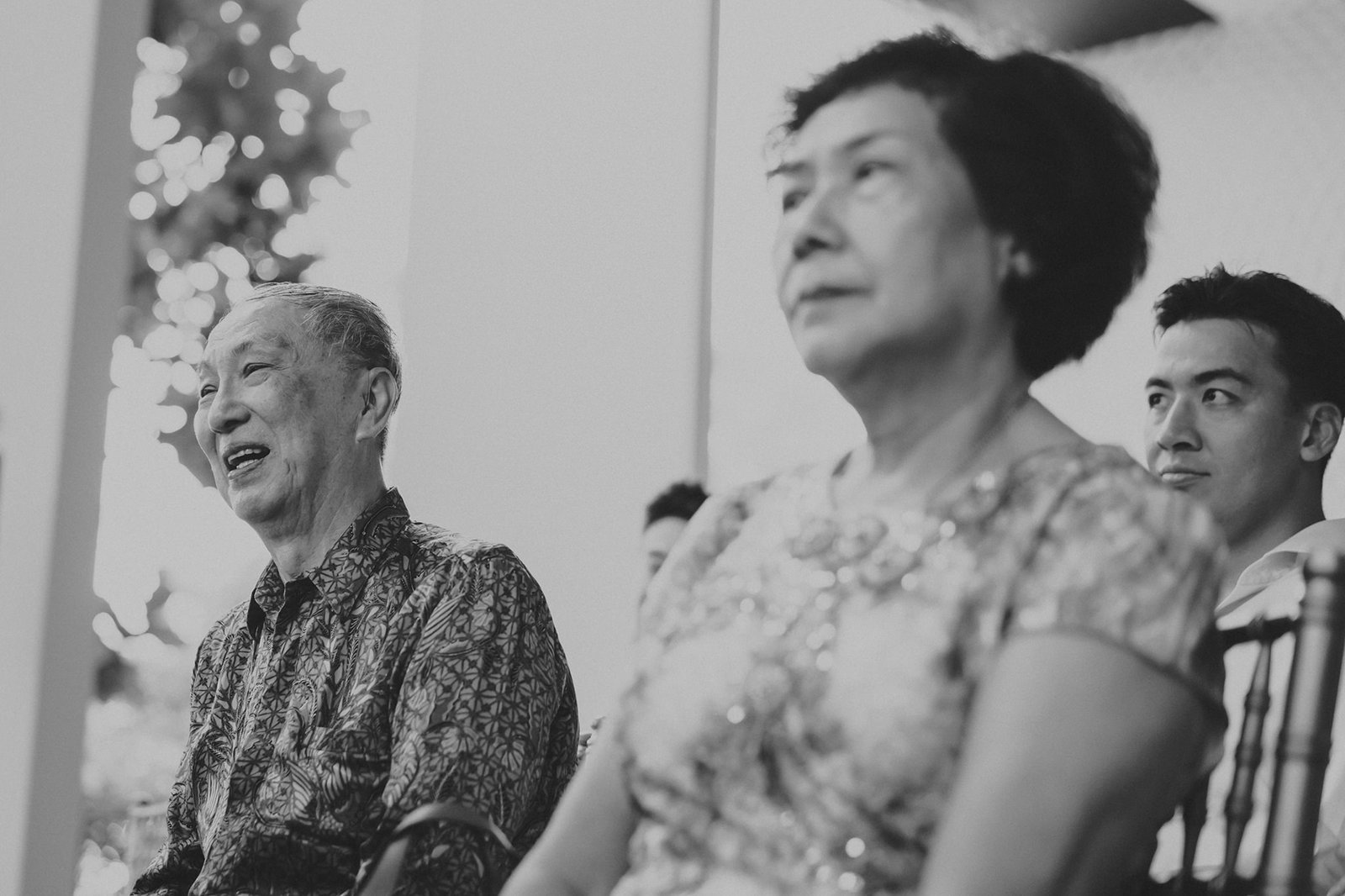 Elderly couple and younger man at Capella Singapore wedding ceremony