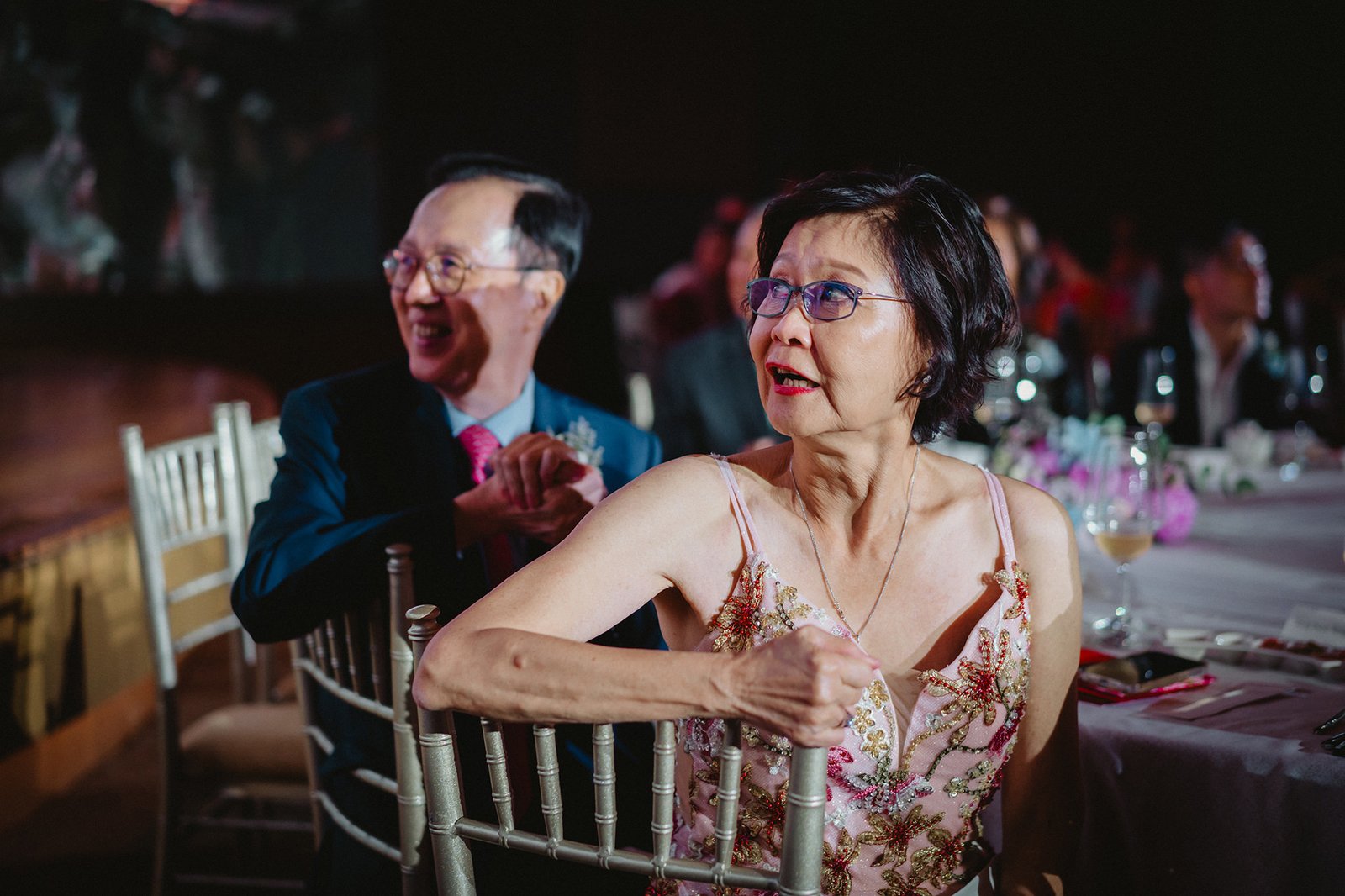 Han and Ming's wedding guests at Capella Singapore, a man and woman smiling