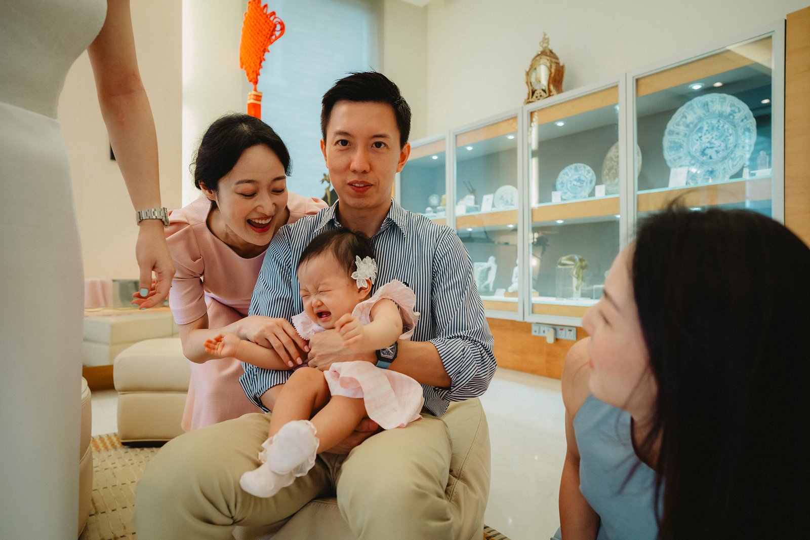 Family at Capella Singapore wedding, parents comfort crying baby