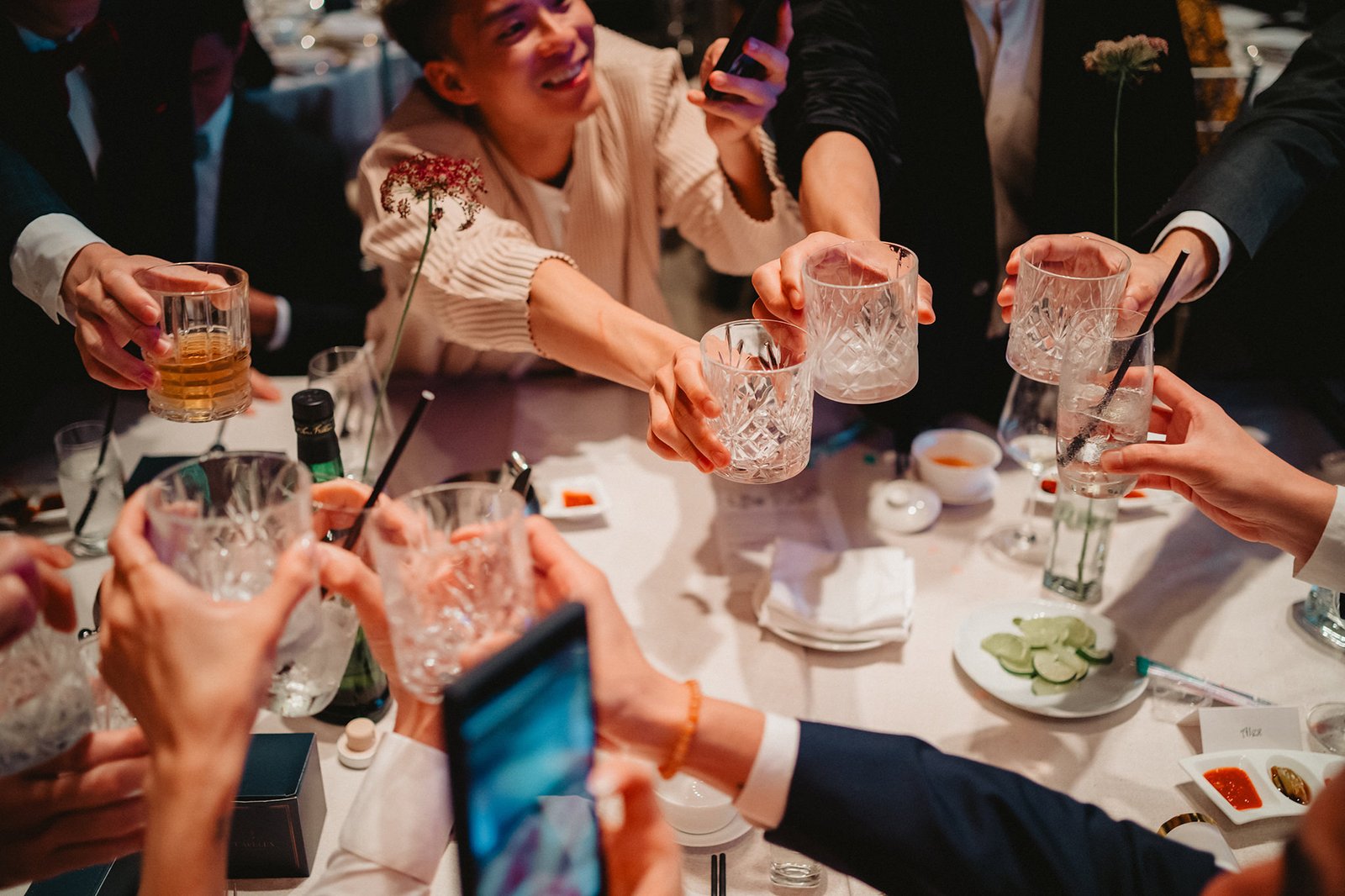 Guests toast at Capella Singapore wedding reception, Han + Ming